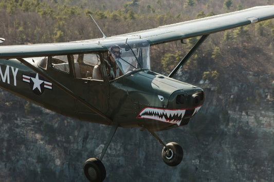 Airplane in flight against a blue sky